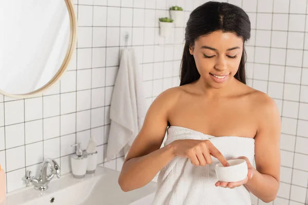 Smiling Young African American Woman Touching Cream Jar Finger Bathroom — Stock Photo, Image