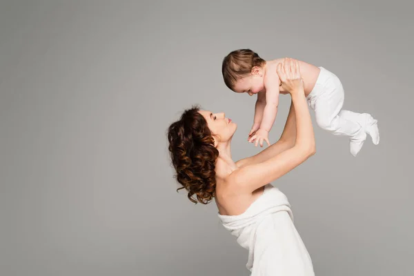 Happy Mother Bare Shoulders Holding Arms Boy Baby Tights Isolated — Stock Photo, Image