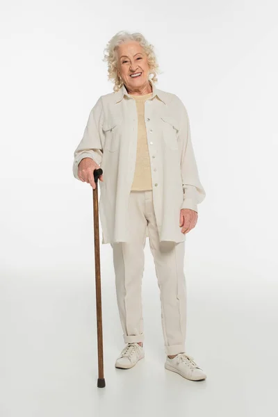 Smiling Elderly Woman Casual Clothes Standing Walking Stick White — Stock Photo, Image