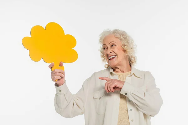 Smiling Elderly Woman Pointing Finger Yellow Thought Bubble Hand Isolated — Stock Photo, Image