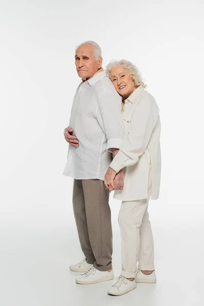 Happy Elderly Woman Gently Hugging Back Husband Holding Hands Looking — Stock Photo, Image