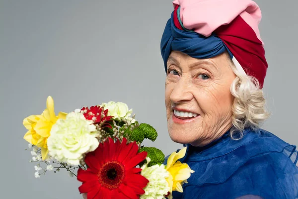 Portrait Smiling Elderly Woman Blue Dress Turban Holding Bouquet Flowers — Stock Photo, Image