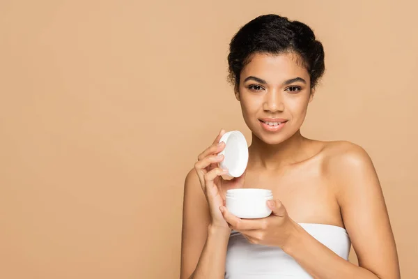 Joyful African American Woman Bare Shoulders Holding Container Cosmetic Cream — Stock Photo, Image