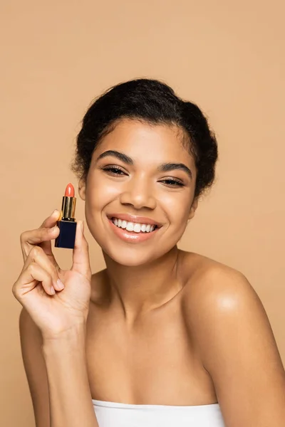 Happy African American Woman Bare Shoulders Holding Lipstick Tube Isolated — Stock Photo, Image