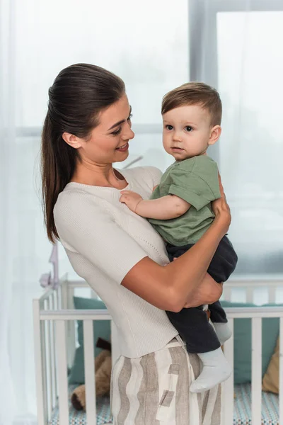 Mother Holding Toddler Son Bedroom — Stock Photo, Image