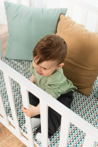 Overhead View Toddler Boy Sitting Baby Bed — Stock Photo, Image