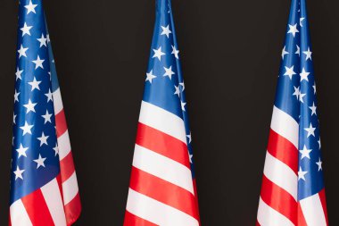 red and blue american flags with stars and stripes isolated on black clipart