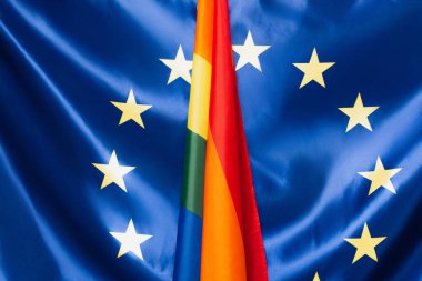 close up of european union and lgbt flags, equality rights concept