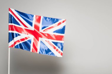 British flag of united kingdom with red cross on grey