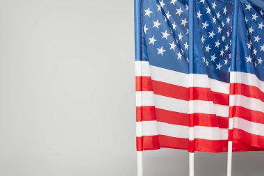 red and blue flags of america with stars and stripes isolated on grey clipart