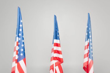 red and blue flags of usa with stars and stripes isolated on grey  clipart