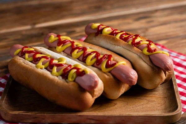 Close View Hot Dogs Mustard Ketchup Plaid Napkin Wooden Surface — Stock Photo, Image