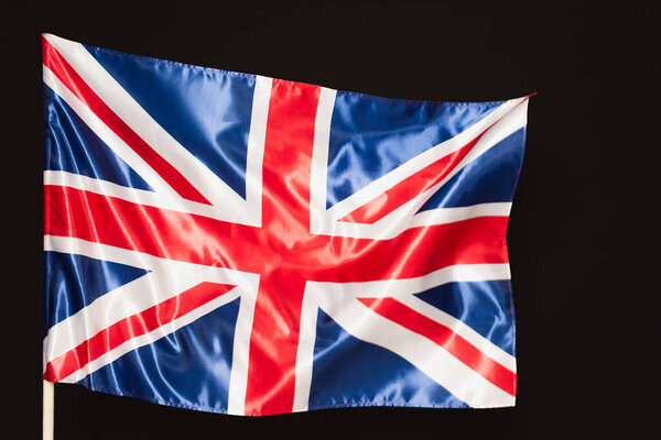 national flag of united kingdom with red cross isolated on black