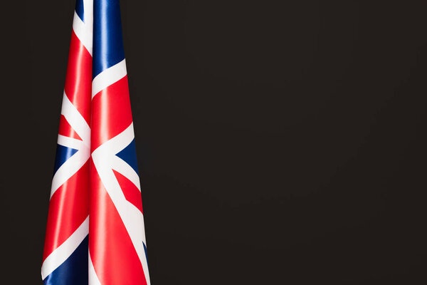 national flag of united kingdom with red cross isolated on black with copy space 