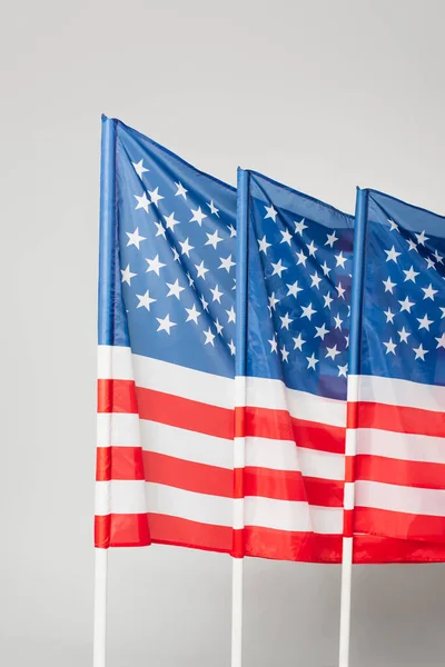 national flags of america with stars and stripes isolated on grey
