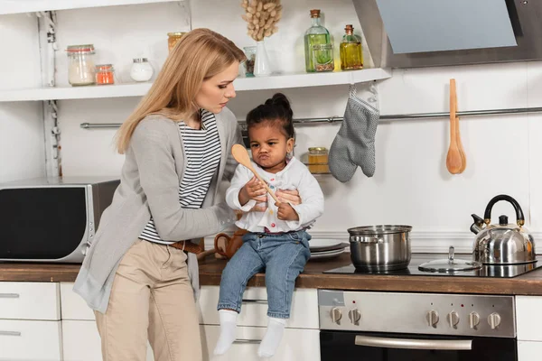 Woman Supporting Adopted African American Kid Wooden Spoon Kitchen — Stock Photo, Image