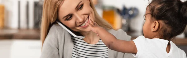 Happy Mother Talking Smartphone Adopted African American Kid Outstretched Hand — Stock Photo, Image