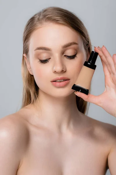 Young Woman Bare Shoulders Holding Tube Face Foundation Isolated Grey — Stock Photo, Image