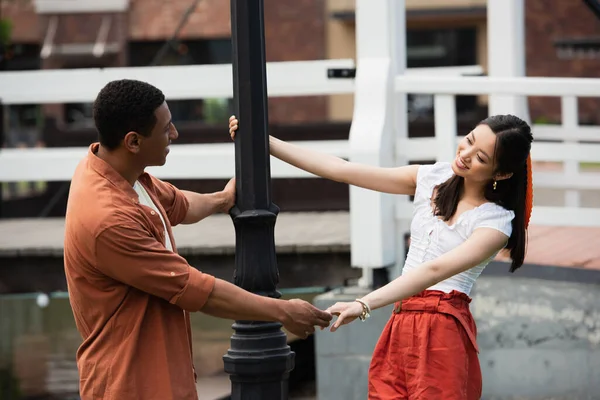 Happy Interracial Couple Holding Hands Looking Each Other Lantern — Stock Photo, Image