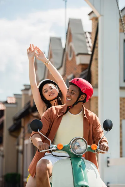 Happy Asian Woman Raised Hands Enjoying Riding Scooter African American — Stock Photo, Image