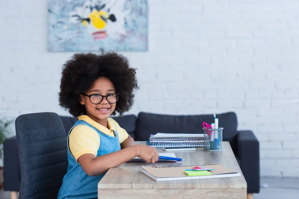 Smiling African American Kid Holding Pen Notebook Home — Stock Photo, Image