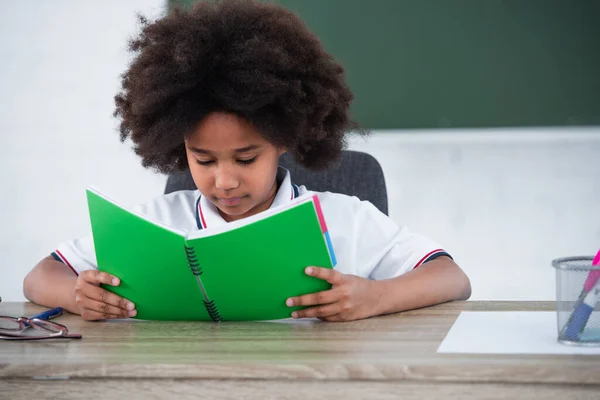 African American Schoolgirl Looking Notebook Classroom — Stock Photo, Image