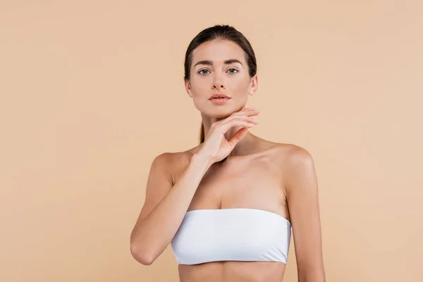 Young Woman White Strapless Top Holding Hand Chin Isolated Beige — Fotografia de Stock