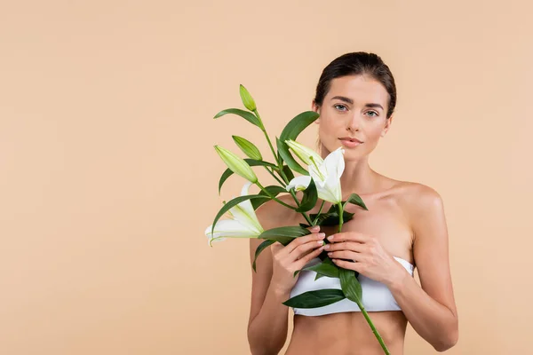 Charming Woman White Lily Flowers Looking Camera Isolated Beige Beauty — Fotografia de Stock