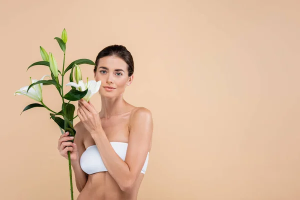 Young Woman White Strapless Bra Holding Lily Flowers Isolated Beige — Fotografia de Stock