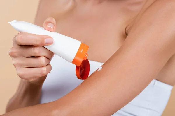 Cropped View Woman Applying Sunscreen Cream Arm Isolated Beige — Stock Photo, Image