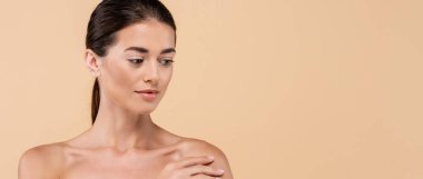 young woman with naked shoulders and perfect skin posing isolated on beige, beauty concept, banner clipart