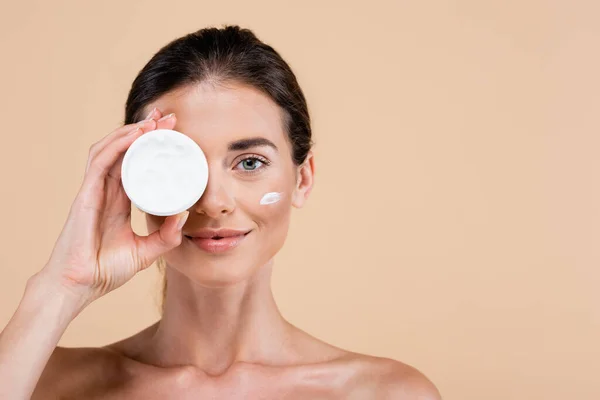 Woman Naked Shoulders Obscuring Face Face Cream Container Isolated Beige — Stok Foto