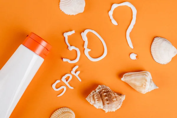 Top View Sunscreen Seashells Spf Lettering Number Fifty Question Mark — Stock Photo, Image