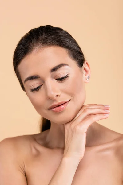 Positive Woman Clean Skin Holding Hand Chin Isolated Beige Beauty — Fotografia de Stock