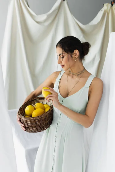 Woman Dress Holding Ripe Lemons Wicker Basket White — Stock Photo, Image