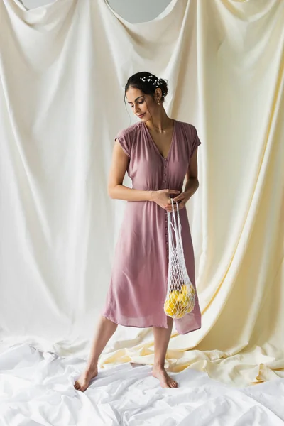 Full Length Brunette Woman Holding Reusable String Bag Lemons White — Stock Photo, Image