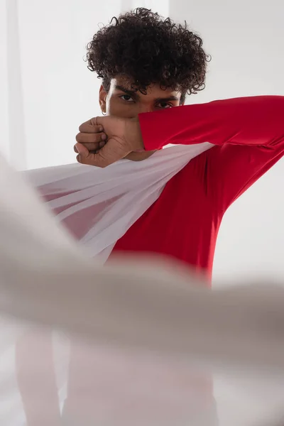 African American Man Looking Camera While Obscuring Face Arm White — Stok Foto