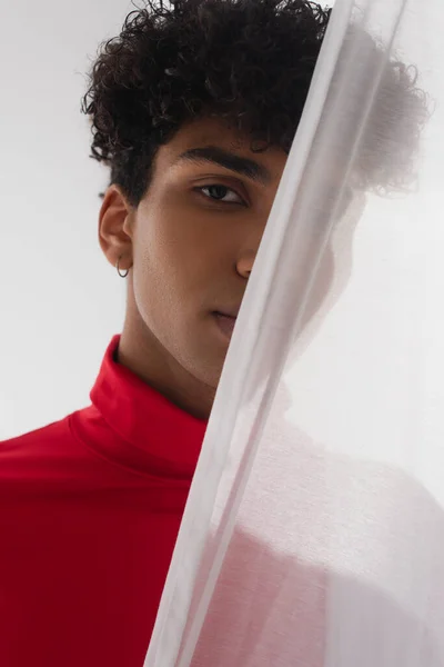 Young African American Man Looking Camera While Hiding White Transparent — Stok fotoğraf