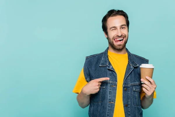 Young Man Sticking Out Tongue While Pointing Coffee Isolated Blue — Stock Photo, Image