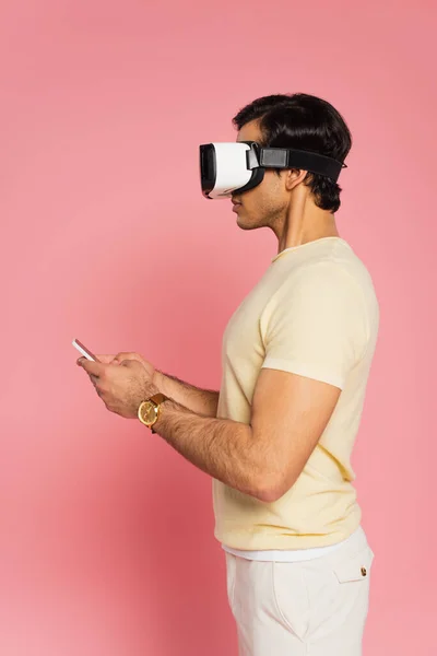 Side View Young Man Headset Using Smartphone Pink — Stock Photo, Image