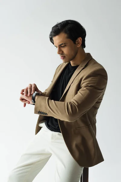 Young Man Stylish Blazer Adjusting Wristwatch Isolated Grey — Stock Photo, Image