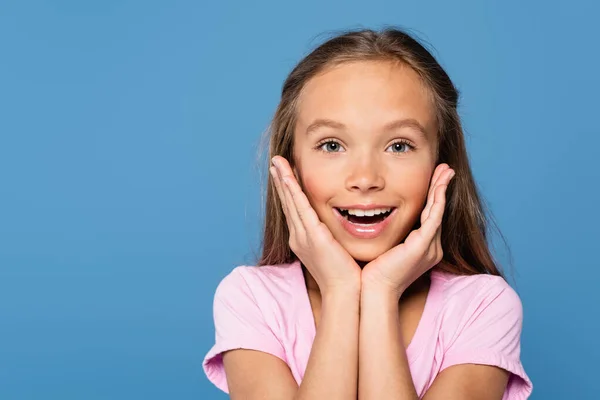 Smiling Kid Holding Hands Face Looking Camera Isolated Blue —  Fotos de Stock