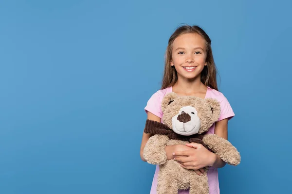 Smiling Child Holding Teddy Bear Isolated Blue — Stock Photo, Image