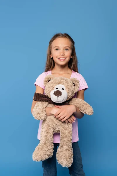 Happy Preteen Girl Holding Soft Toy Isolated Blue — Foto de Stock