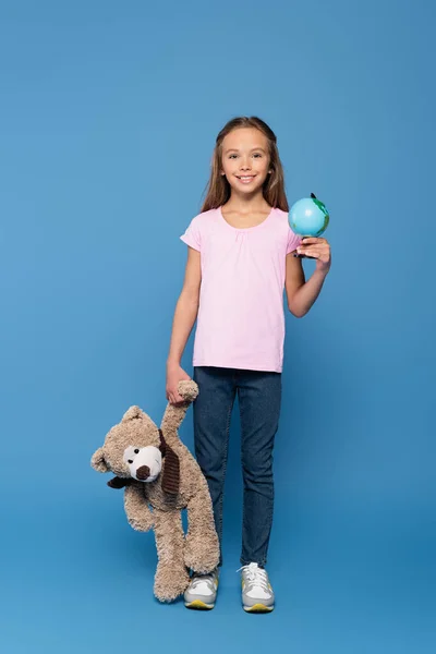 Smiling Child Holding Soft Toy Globe Blue Background — Stock Photo, Image