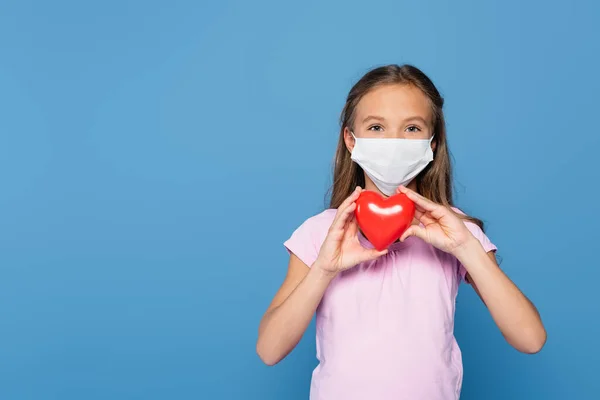 Child Medical Mask Holding Red Heart Isolated Blue — Foto de Stock