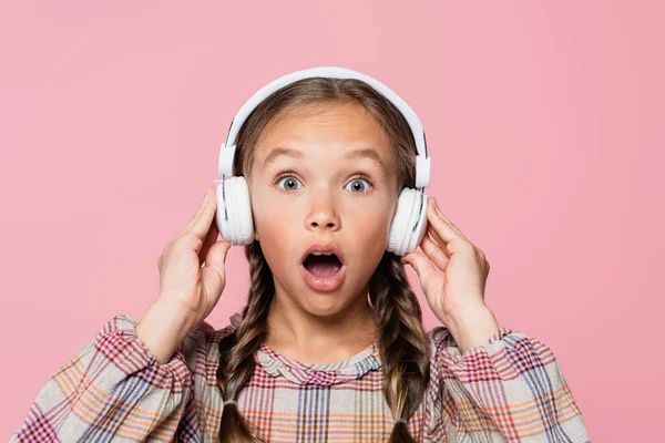 Amazed Child Headphones Looking Camera Isolated Pink —  Fotos de Stock