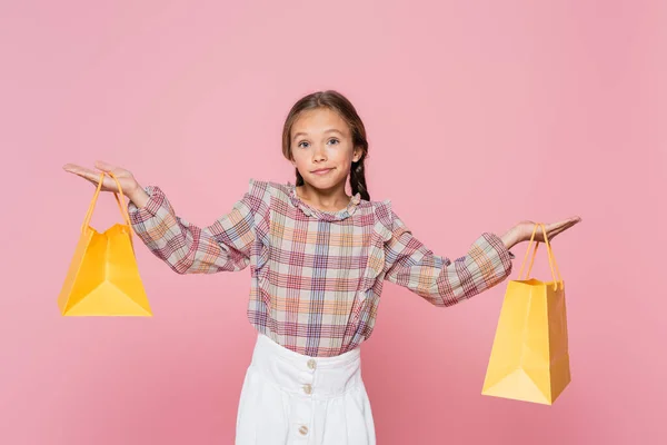 Girl Trendy Clothes Showing Shrug Gesture While Holding Yellow Shopping — Stock Photo, Image