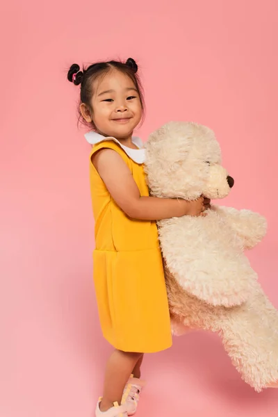 Happy Asian Girl Yellow Dress Holding Teddy Bear Pink — Stock Photo, Image