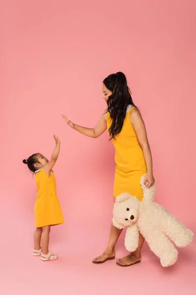 Cheerful Asian Woman Holding Teddy Bear Giving High Five Happy — Stock Photo, Image